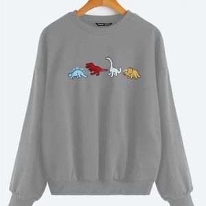 Woman’s dinosaur sweater size large